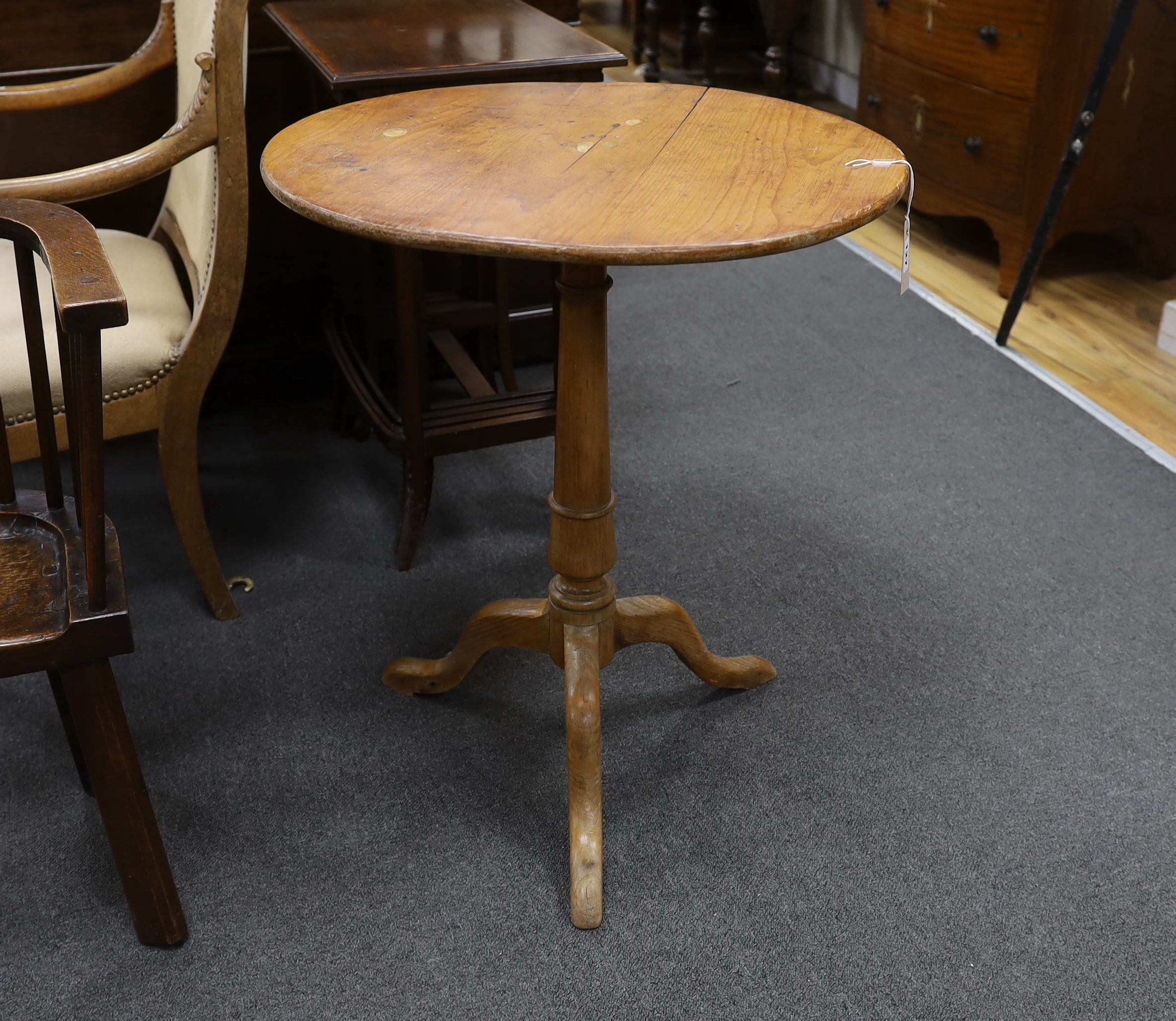 A 19th century circular pine tripod tea table, diameter 60cm, height 71cm